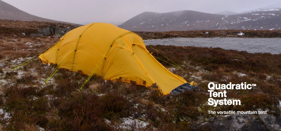 Quadratic tent pitched by a lake in high winds